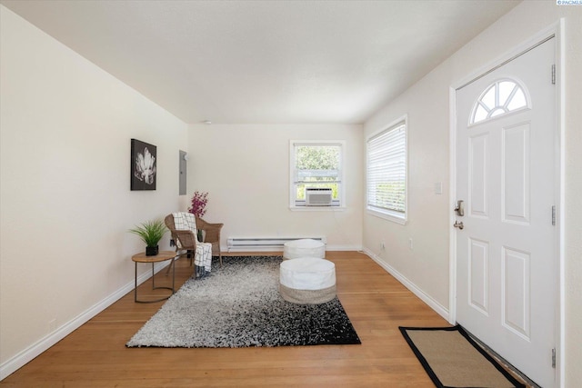 1205 N Union St, Kennewick, WA 99336 - entrance foyer with light wood-style floors, baseboards, a baseboard heating unit, and cooling unit