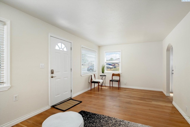 1205 N Union St, Kennewick, WA 99336 - entrance foyer with arched walkways, light wood finished floors, and baseboards