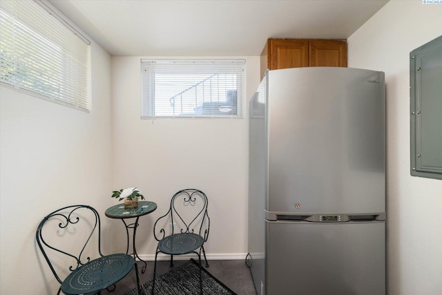 1205 N Union St, Kennewick, WA 99336 - kitchen with freestanding refrigerator, electric panel, baseboards, and carpet floors