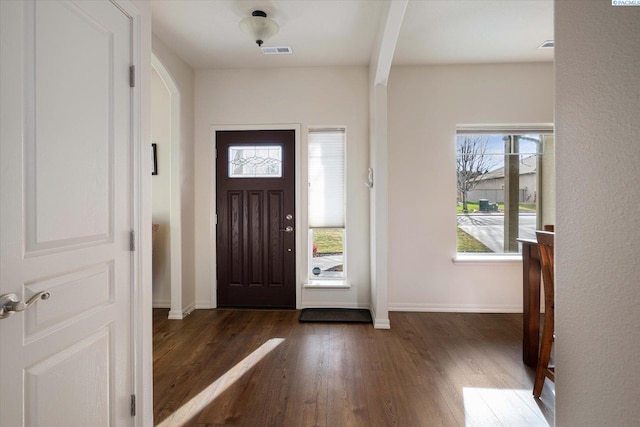 foyer entrance featuring dark hardwood / wood-style flooring