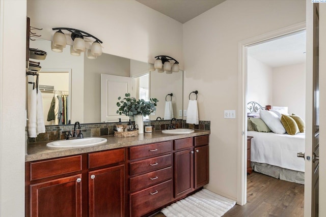 bathroom featuring vanity and wood-type flooring