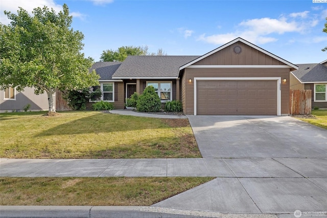 5905 W 4th Pl, Kennewick, WA 99336 - single story home featuring concrete driveway, a front yard, fence, and a garage