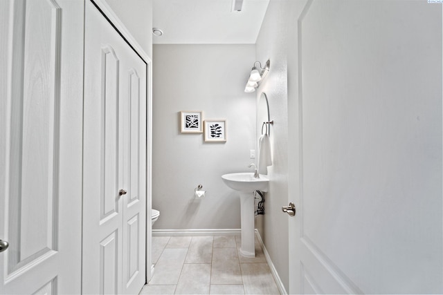 9411 Vincenzo Dr, Pasco, WA 99301 - half bathroom featuring tile patterned floors and a closet