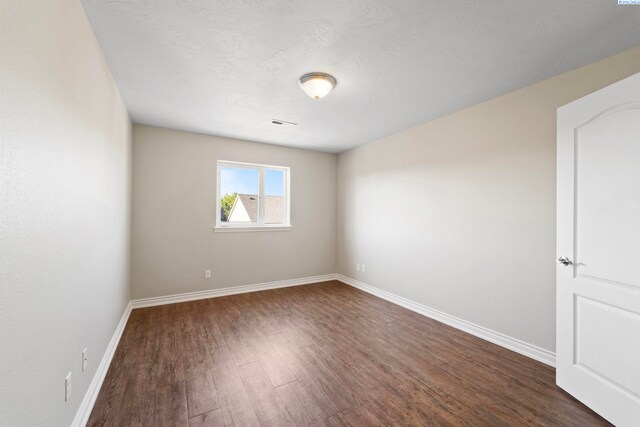 9411 Vincenzo Dr, Pasco, WA 99301 - unfurnished room with dark wood-style floors and baseboards