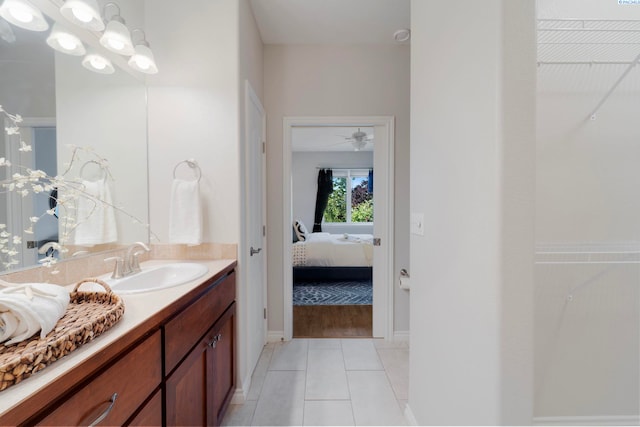 9411 Vincenzo Dr, Pasco, WA 99301 - ensuite bathroom with vanity, tile patterned floors, a spacious closet, and ceiling fan