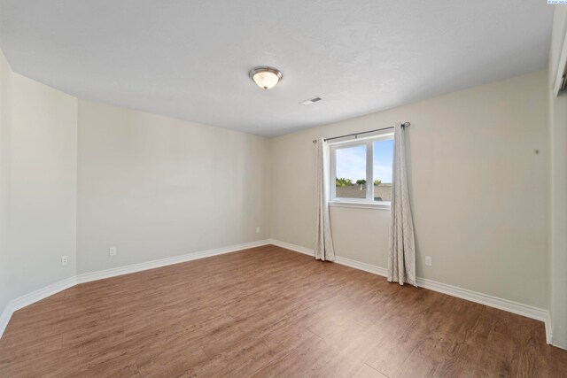 9411 Vincenzo Dr, Pasco, WA 99301 - unfurnished room featuring wood finished floors and baseboards