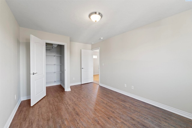 9411 Vincenzo Dr, Pasco, WA 99301 - unfurnished bedroom featuring wood finished floors and a closet