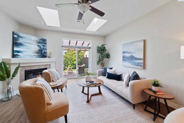 9411 Vincenzo Dr, Pasco, WA 99301 - living room with a skylight, wood finished floors, a high end fireplace, and ceiling fan