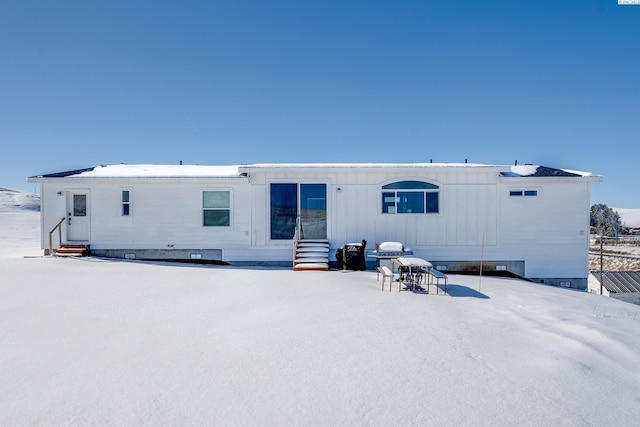 view of snow covered house