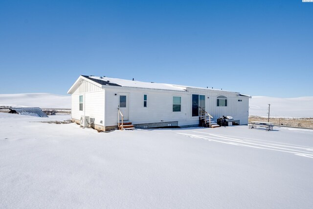 2001 Whelan Rd, Pullman, WA 99163 - snow covered back of property featuring entry steps