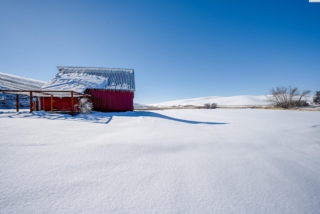 2001 Whelan Rd, Pullman, WA 99163 - snowy yard with an outdoor structure and a pole building