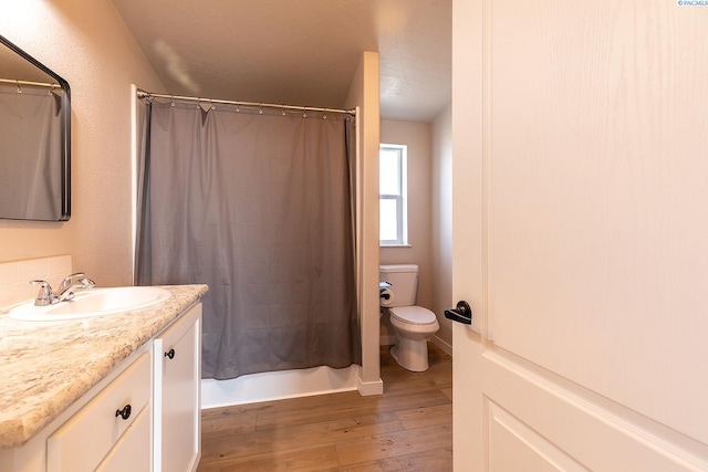 2001 Whelan Rd, Pullman, WA 99163 - full bath featuring vanity, toilet, and hardwood / wood-style floors