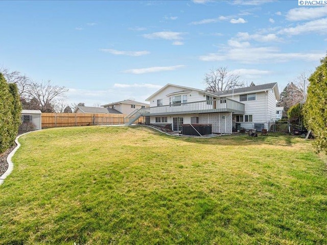1842 Mahan Ave, Richland, WA 99354 - rear view of house with a wooden deck, a lawn, and a fenced backyard