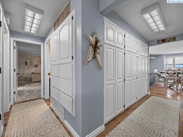 1842 Mahan Ave, Richland, WA 99354 - hallway with baseboards and wood finished floors