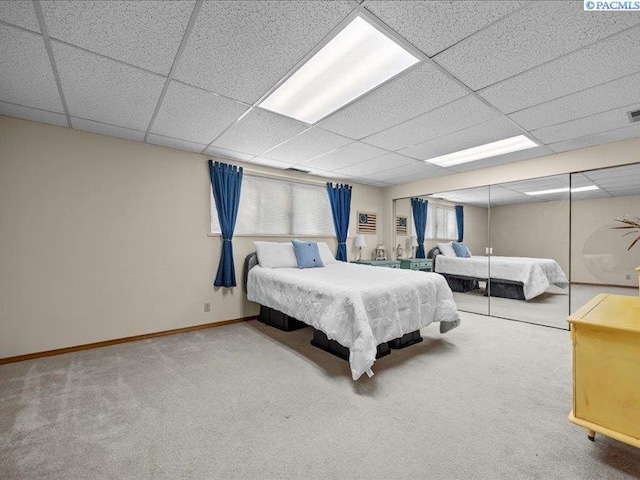 1842 Mahan Ave, Richland, WA 99354 - unfurnished bedroom featuring carpet, baseboards, and a paneled ceiling