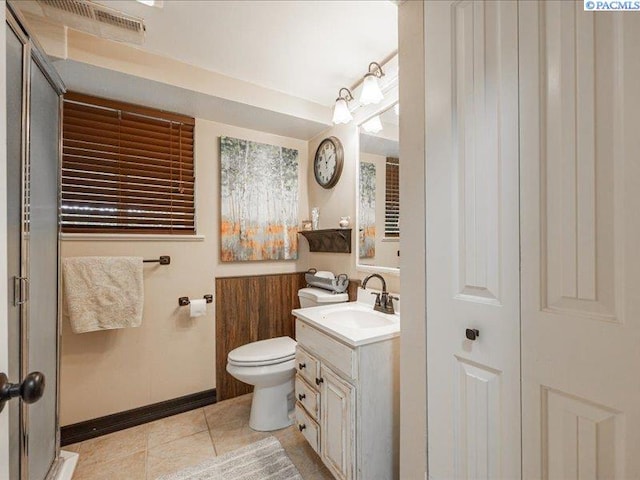 1842 Mahan Ave, Richland, WA 99354 - bathroom featuring vanity, tile patterned floors, toilet, and baseboards