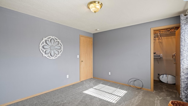 4504 S Dayton Ct, Kennewick, WA 99337 - unfurnished bedroom with carpet, a walk in closet, and a closet
