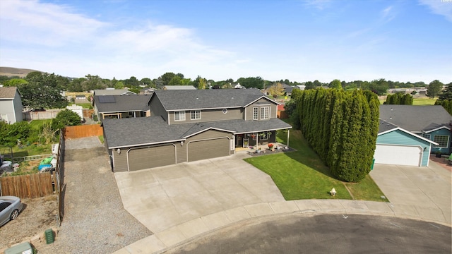 4504 S Dayton Ct, Kennewick, WA 99337 - traditional-style house with concrete driveway, a residential view, and covered porch
