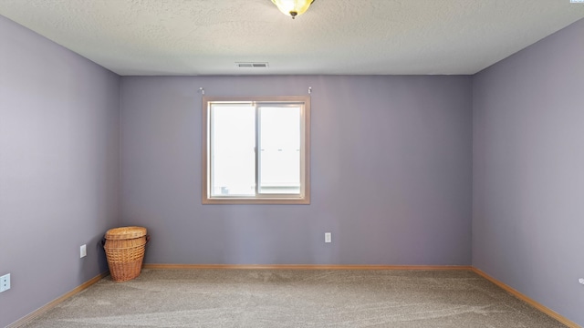 4504 S Dayton Ct, Kennewick, WA 99337 - carpeted empty room with a textured ceiling