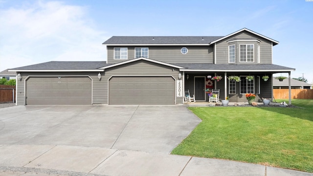 4504 S Dayton Ct, Kennewick, WA 99337 - view of front of property featuring a porch, concrete driveway, and a garage