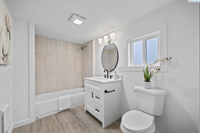 807 Snow, Richland, WA 99352 - bathroom featuring vanity, tub / shower combination, and wood finished floors