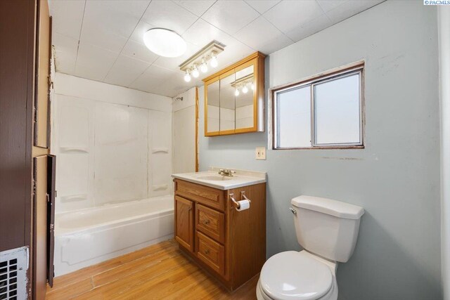 807 Snow, Richland, WA 99352 - bathroom featuring vanity, wood finished floors, and shower / tub combination