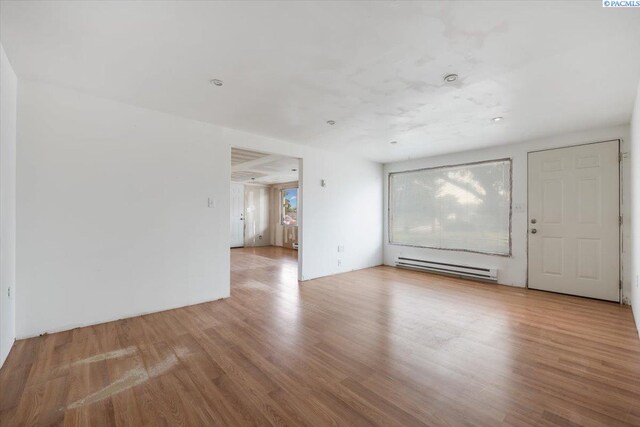 807 Snow, Richland, WA 99352 - unfurnished room with baseboard heating and wood finished floors