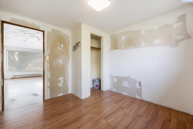 807 Snow, Richland, WA 99352 - empty room with light wood-style flooring and baseboard heating