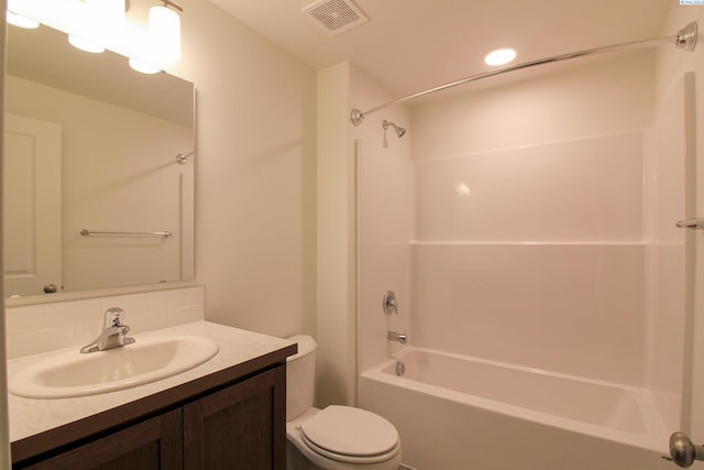 full bathroom with vanity, tasteful backsplash, toilet, and washtub / shower combination