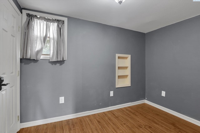436 N Washington St, Tekoa, WA 99033 - empty room featuring wood finished floors and baseboards