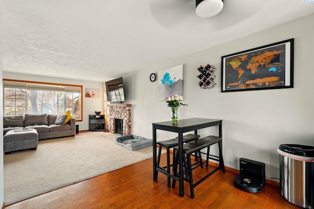 1584 Cimarron Ave, Richland, WA 99352 - dining room with a fireplace, baseboards, hardwood / wood-style floors, and ceiling fan