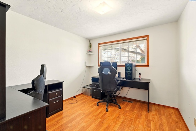 1584 Cimarron Ave, Richland, WA 99352 - office area featuring baseboards, visible vents, light wood-type flooring, and a textured ceiling