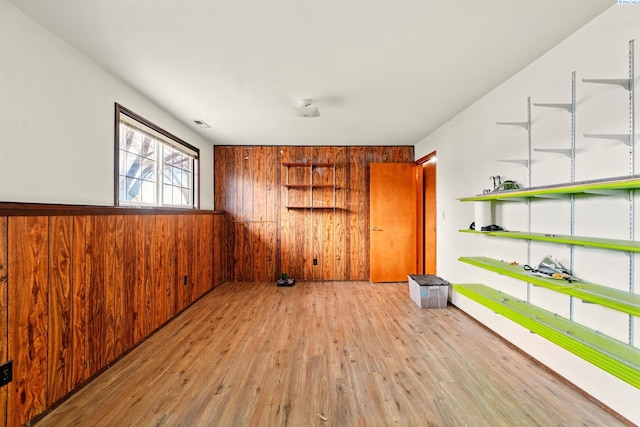 1584 Cimarron Ave, Richland, WA 99352 - unfurnished room featuring wood finished floors, wooden walls, and wainscoting