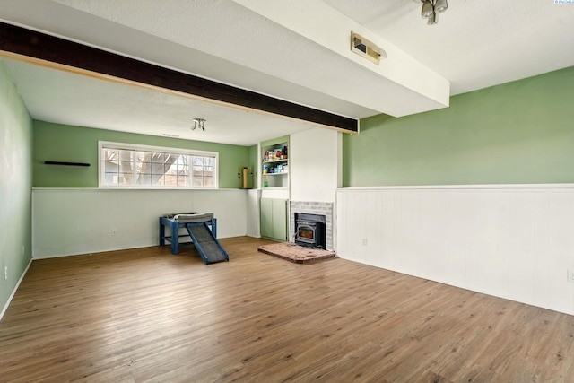 1584 Cimarron Ave, Richland, WA 99352 - unfurnished living room featuring beam ceiling, wainscoting, and wood finished floors