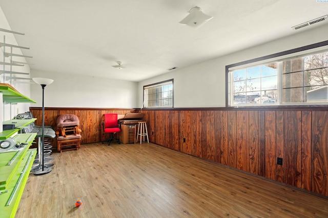 1584 Cimarron Ave, Richland, WA 99352 - living area with wood finished floors, wooden walls, wainscoting, and visible vents