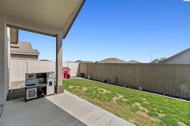 view of yard with a fenced backyard and a patio