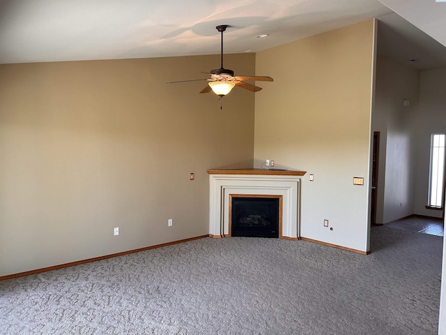 unfurnished living room featuring carpet flooring, a fireplace, a ceiling fan, vaulted ceiling, and baseboards
