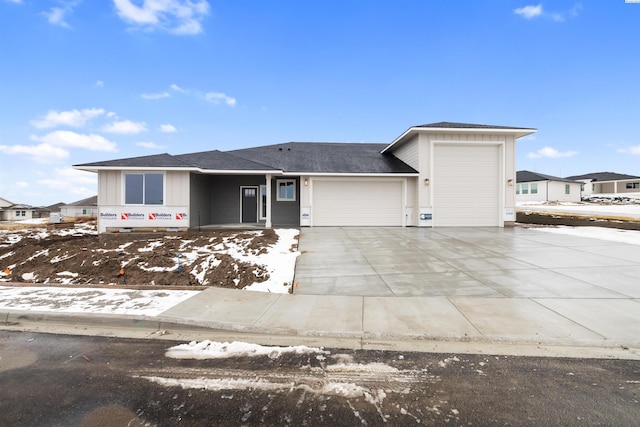 view of front of home featuring driveway and an attached garage