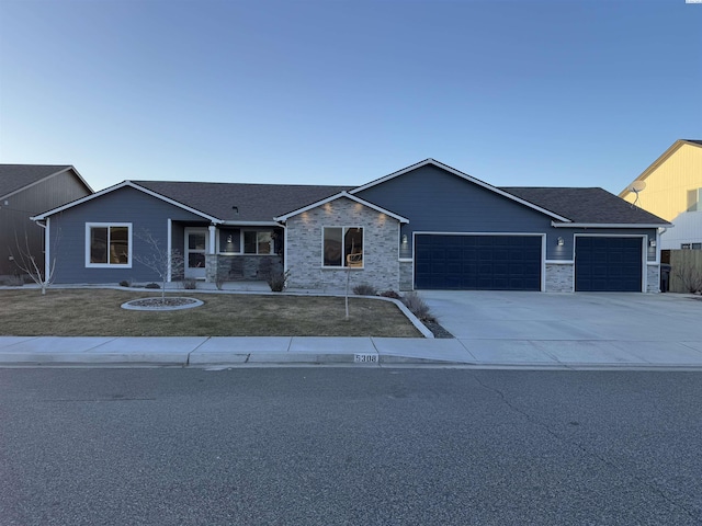 ranch-style house featuring driveway, a front lawn, a garage, and roof with shingles