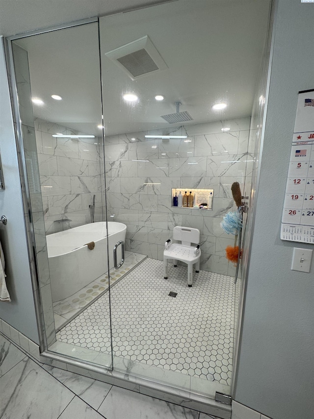 bathroom with a marble finish shower, visible vents, and marble finish floor