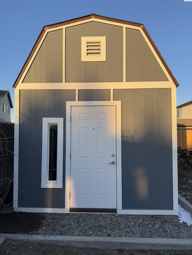 view of outbuilding with an outbuilding and fence