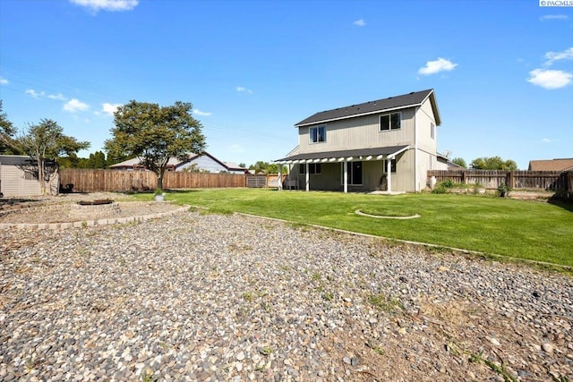 rear view of property featuring a shed and an outbuilding