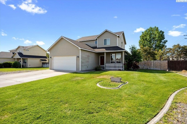 traditional-style house with covered porch, driveway, and an attached garage