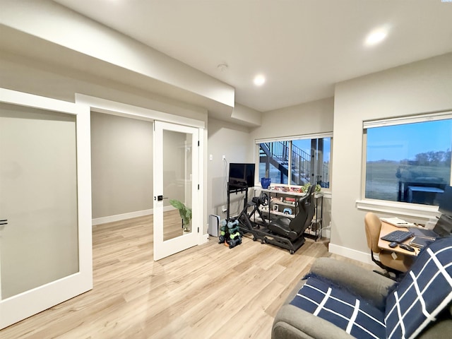 interior space featuring recessed lighting, wood finished floors, and baseboards