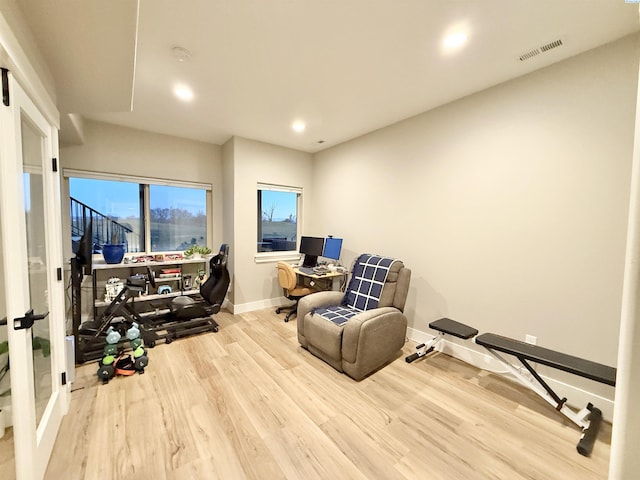 office featuring baseboards, visible vents, wood finished floors, and recessed lighting