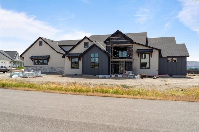 11812 Tschirky Ct, Pasco, WA 99301 - view of front facade featuring board and batten siding, a shingled roof, and stone siding