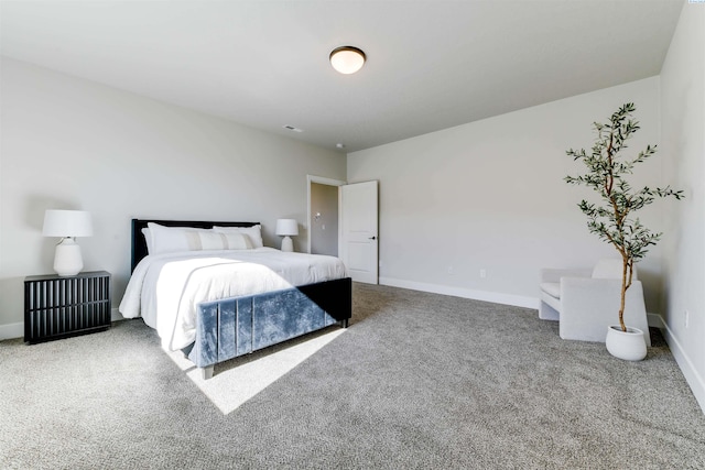 carpeted bedroom with baseboards and visible vents