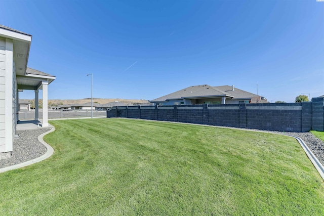 view of yard featuring a fenced backyard