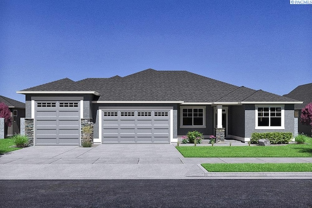 2781 Avrio Ave, Richland, WA 99354 - view of front facade featuring an attached garage, concrete driveway, stucco siding, stone siding, and a front yard