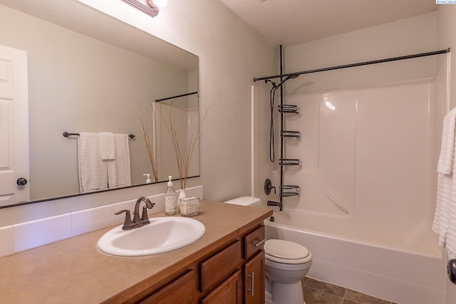 bathroom with vanity, shower / tub combination, tile patterned floors, and toilet